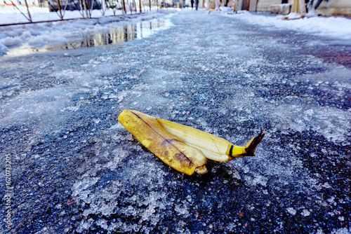 Terrible slippery weather out of doors. Icy roads and uncluttered streets. There's a lot of snow, you can slip and fall. Accident, slip and banana peel