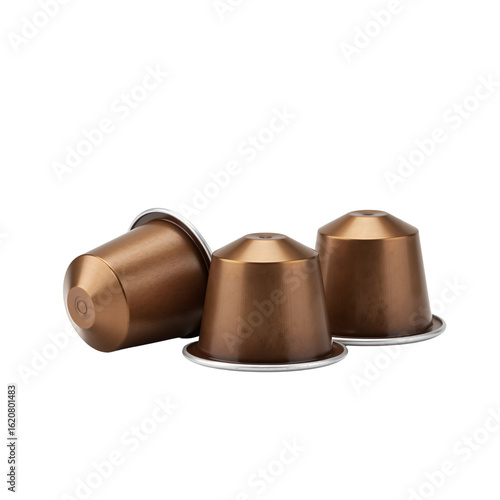 Three bronze coffee capsules arranged on a white background  