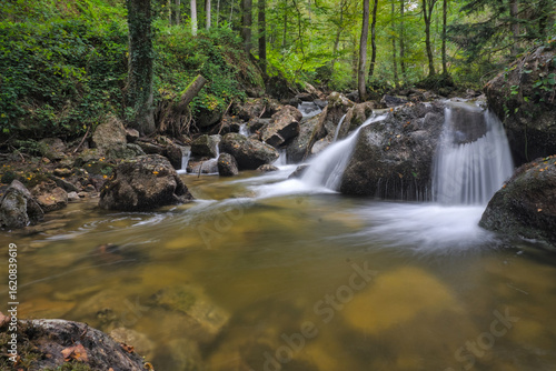 Ysperklamm, Austria: Cascading waterfall over mossy rocks in a lush, forested gorge.

