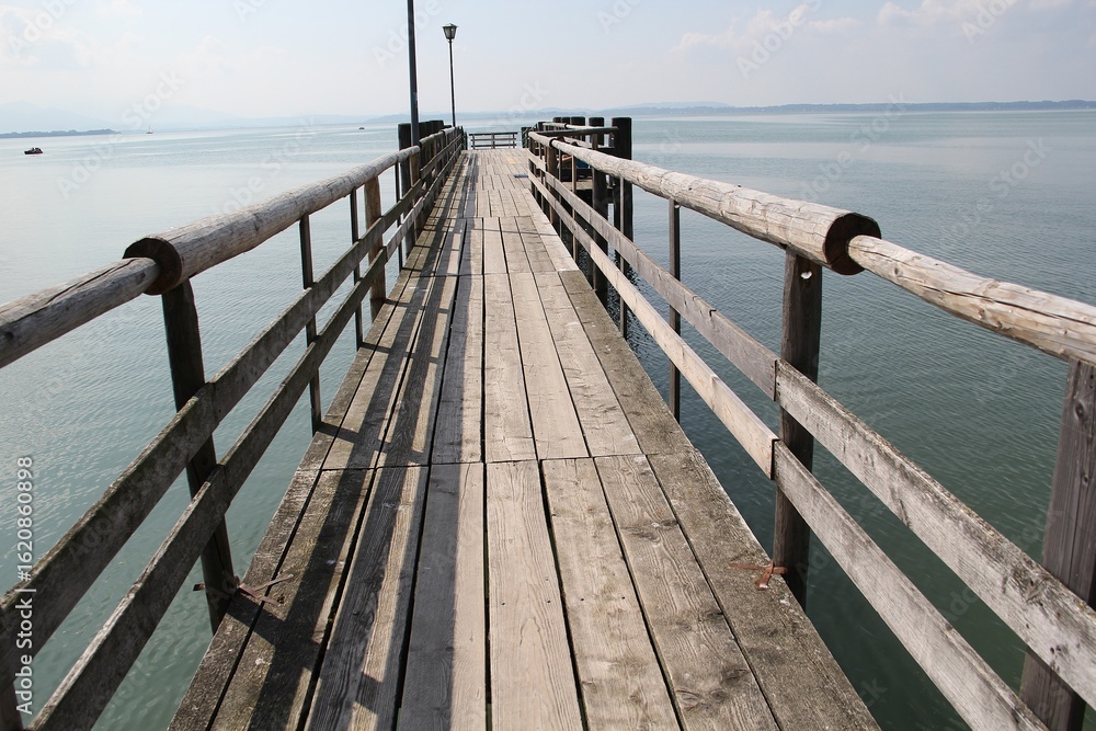 Fototapeta premium an empty wooden pier on the lake