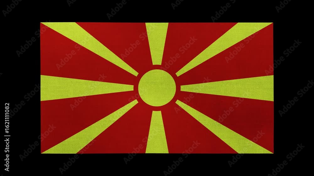 A Macedonia flag rolls and waves in front of a black background. A Macedonia flag rolls and waves in front of a black background.