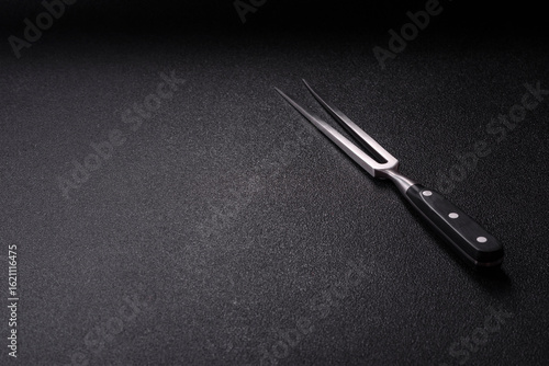 Wallpaper Mural Empty meat or steak fork with vegetables, spices and other ingredients. Meat fork Torontodigital.ca