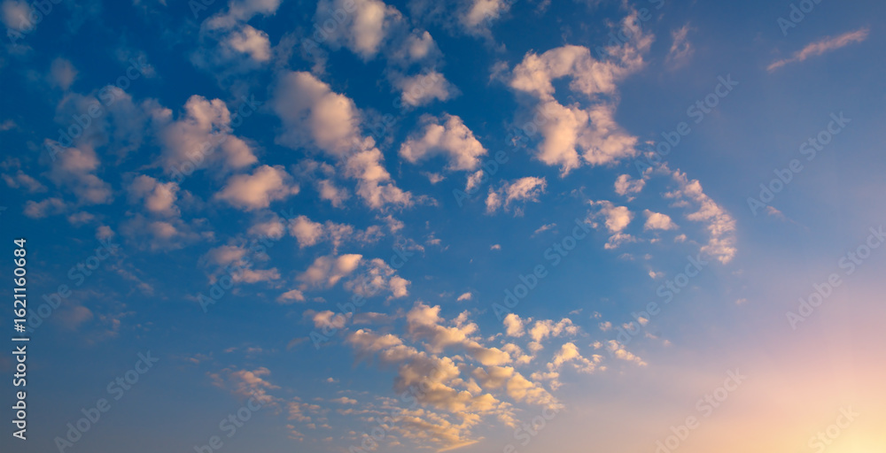 Sunset with bright sun, blue sky and pink clouds Sunset with bright sun, blue sky and pink clouds