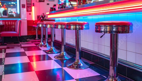 Retro Diner Interior Featuring Red Stools Neon Lights Checkered Floor Tiles