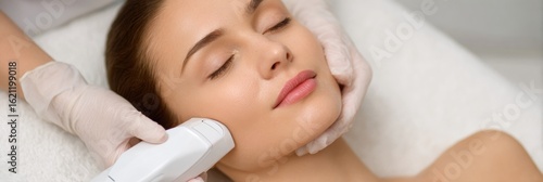 Dermatology Laser Treatment Focusing on Device Application on a Smooth Cheek in a Pastel Clinic Background
