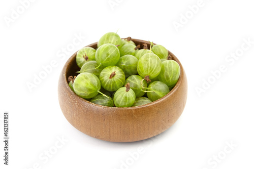 Wallpaper Mural Fresh green gooseberries arranged in a wooden bowl, showcasing their vibrant color and natural texture, perfect for culinary uses or healthy snacking options Torontodigital.ca