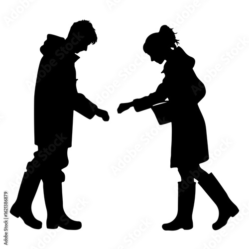 Silhouettes of man and woman feeding animals in farm clothing