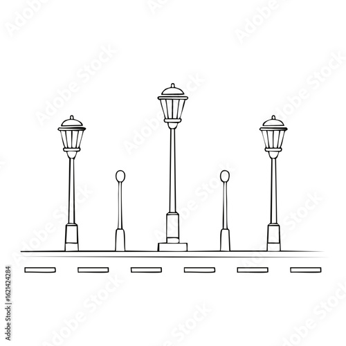 Row of vintage street lamps and modern lampposts lining a sidewalk and road