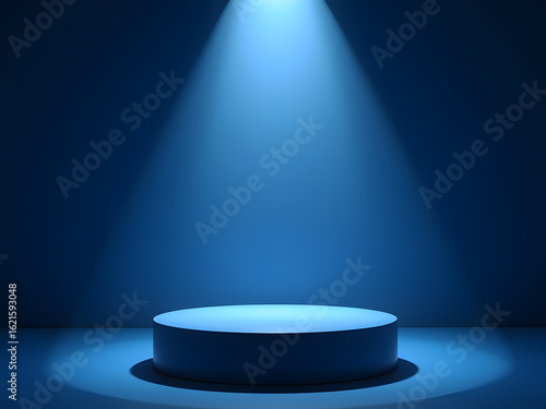 A round, blue cylinder stage is illuminated by a bright spotlight against a dark blue background, creating a dramatic and focused presentation space.