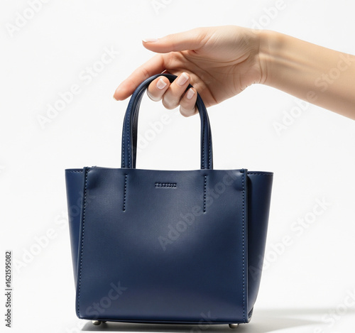 hand holding shopping bag isolated on white