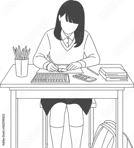 Young student diligently drawing at a desk with art supplies.