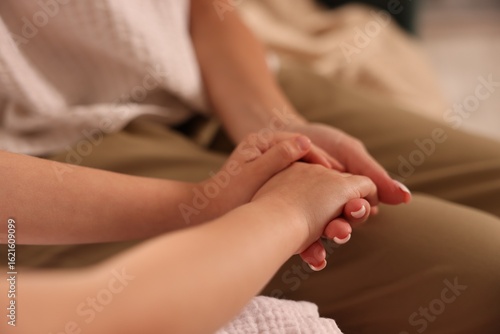 Wallpaper Mural Mother with her daughter holding hands after apology indoors, closeup Torontodigital.ca