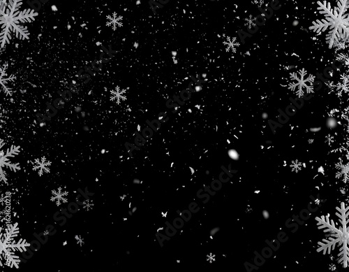 Snowflakes falling on black background