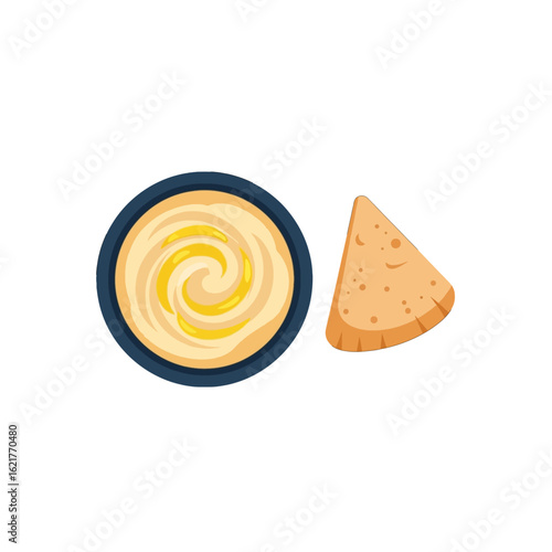 Creamy hummus in a bowl served with a triangular pita bread chip.