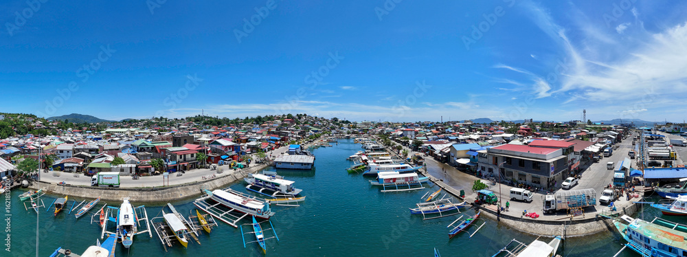 Obraz premium Aerial View of Surigao City Port and Boat Docking Area