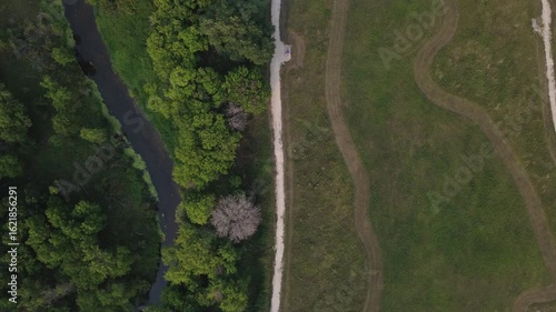 Triple view - River, trail and green lawn park zone