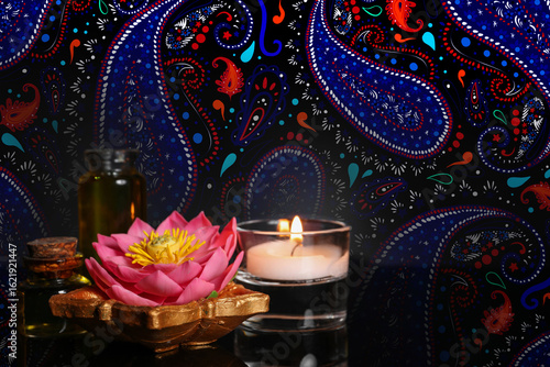 Burning candle with Diya la...