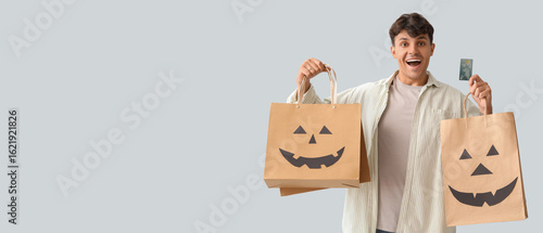Young man with shopping bag...