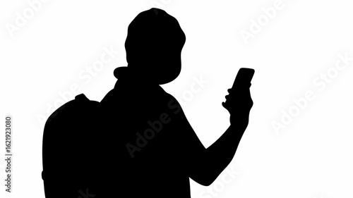 Silhouette of person with backpack looking at a mobile phone against a white background in a studio shot