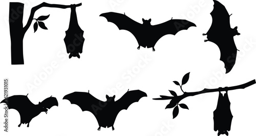 Bat silhouettes on branches and flying