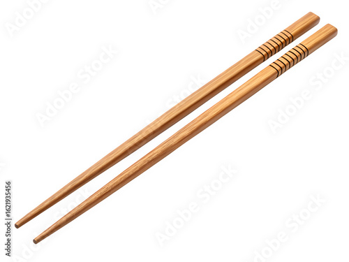 Pair of wooden chopsticks with decorative bands on a black background