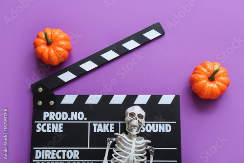 Clapperboard with pumpkins ...