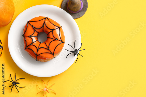 Plate of tasty donut with d...