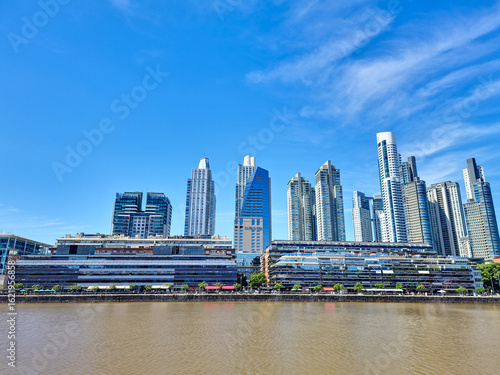 The modern Puerto Madero district in Buenos Aires. Majestic skyscrapers and a lively atmosphere of the coastal promenade.