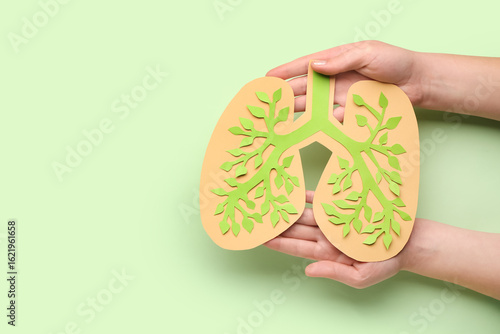 Female hands with paper lun...