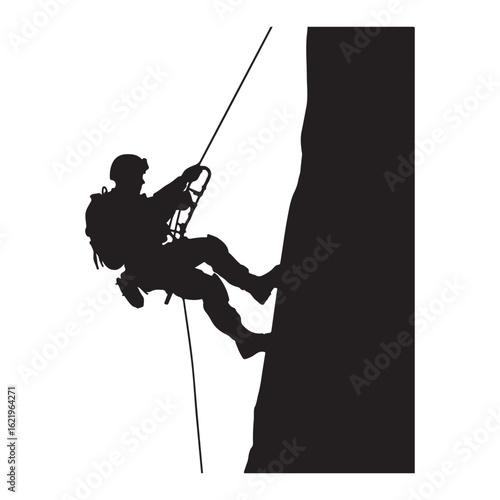 Silhouette of a person rappelling down a steep rock face