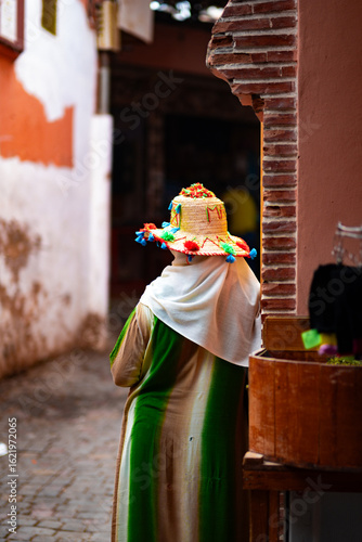 Old lady with a colourful dress in the Medina 