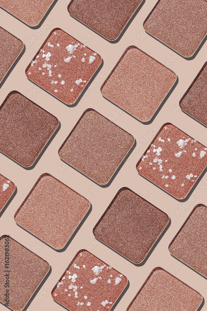 Fototapeta premium Cosmetics texture pattern, makeup palette vivid neutral color eye shadow, square eye powder swatches. Female cosmetic and beauty products, aesthetic minimal beauty photo, shimmer eyeshade, top view