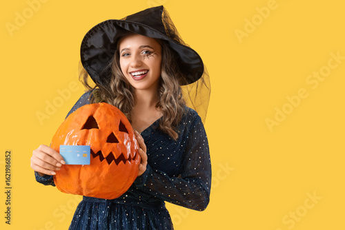 Young woman dressed as witc...