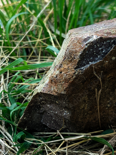 Close-up shot of a textured rock surface showcasing earthy tones of brown, red, and gray