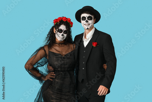 Young couple dressed for Ha...