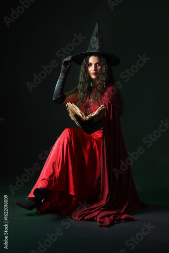 Young witch with spell book...