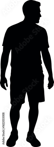 Full body athletic man in shorts and t shirt standing and looking to the side silhouette