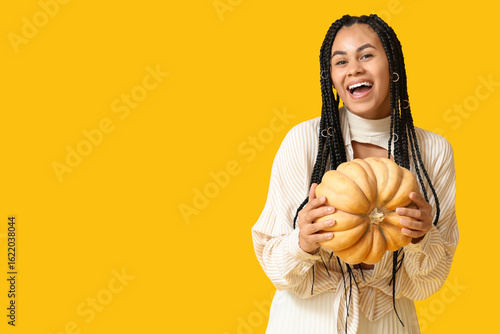 Happy young woman holding a...