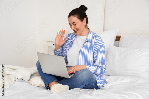Beautiful woman with laptop...