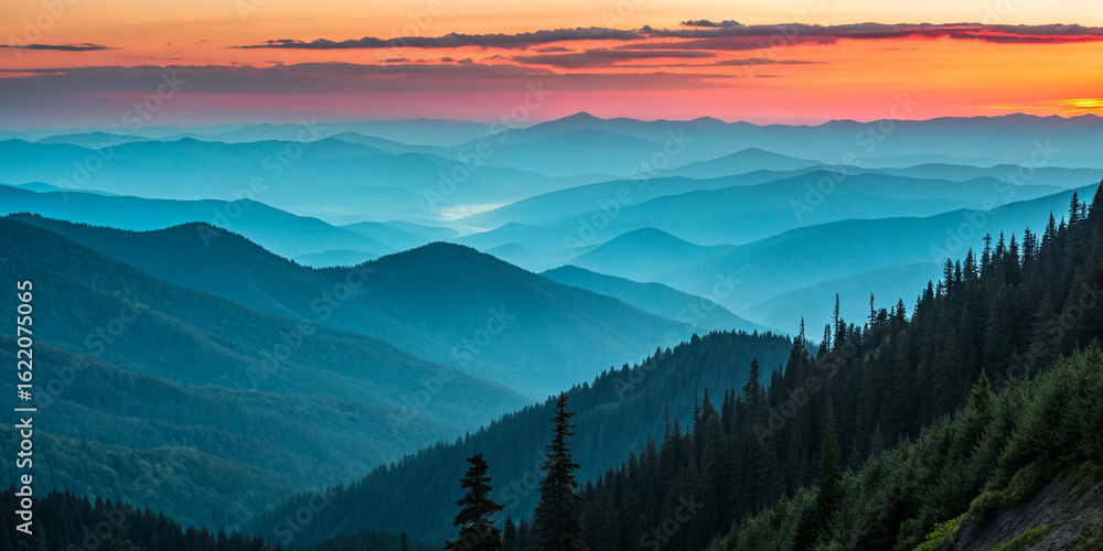 Obraz premium Layered mountain range at sunset with vibrant sky mountains landscape