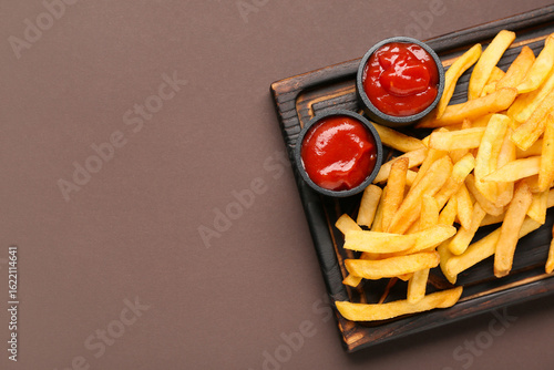 Wooden board with tasty fre...