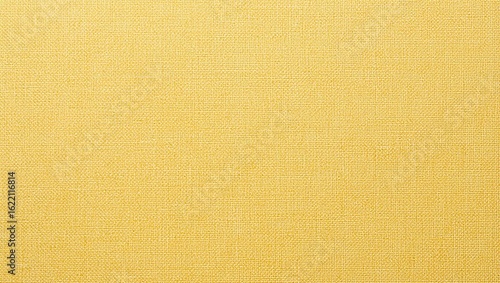 A textured yellow fabric surface providing a vibrant and lively backdrop for various design projects.