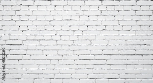 A white painted brick wall with a regular stretcher bond pattern