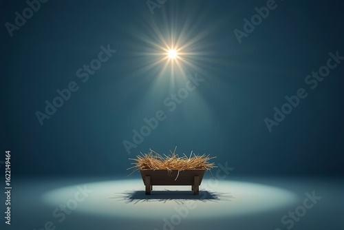 A dramatic nativity scene at night with an empty wooden manger in the center, softly lit by a single bright star shining