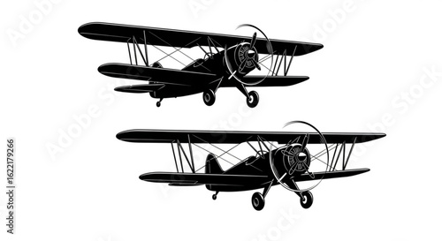 Two vintage biplanes in black and white isolated on white background
