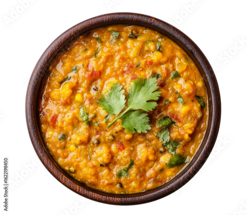 Delicious indian dal tadka in a wooden bowl garnished with fresh cilantro leaves transparent background