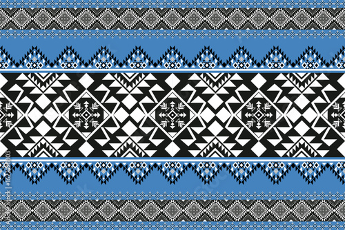 Seamless geometric white and grey shape for ethnic tradition pattern texture on natural blue and black background