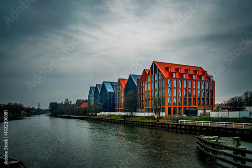 Cold autumn day in Elblag, modern houses on the riverbank