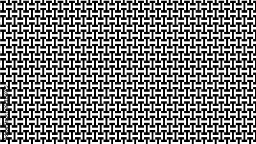 A repeating pattern of black t shapes on a white background creating a geometric design effect