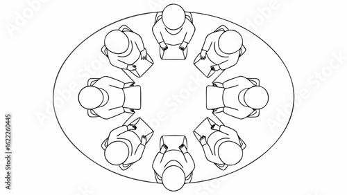 Aerial view of eight people sitting around an oval table holding papers in a meeting setting
